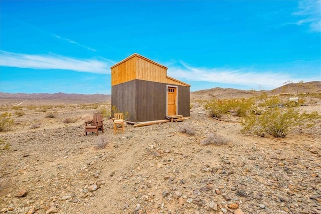 view of shed with a mountain view