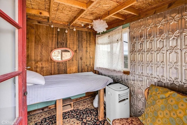 bedroom with wood walls
