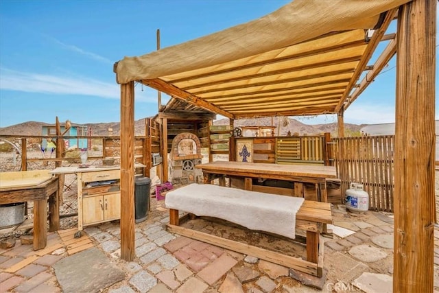 view of patio / terrace with an exterior structure and an outbuilding
