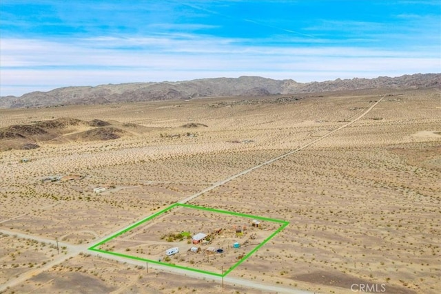 aerial view with view of desert, a rural view, and a mountain view