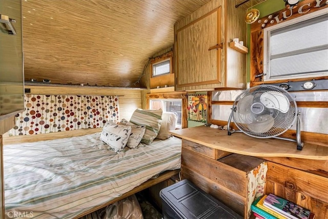 bedroom featuring wooden ceiling and vaulted ceiling