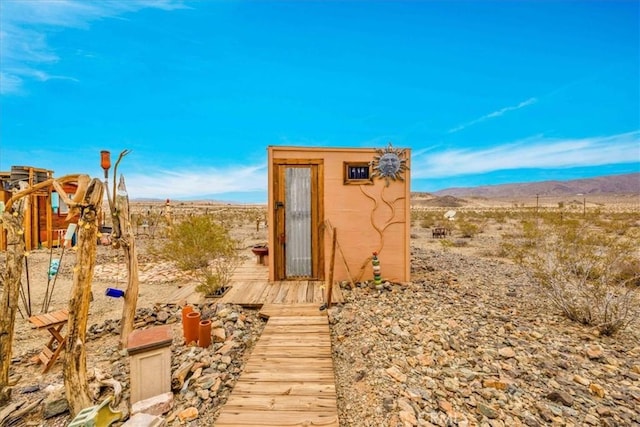 view of outbuilding featuring a mountain view