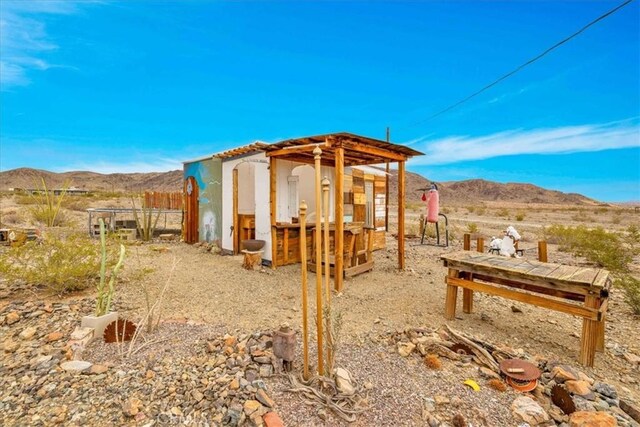 exterior space with an outbuilding and a mountain view