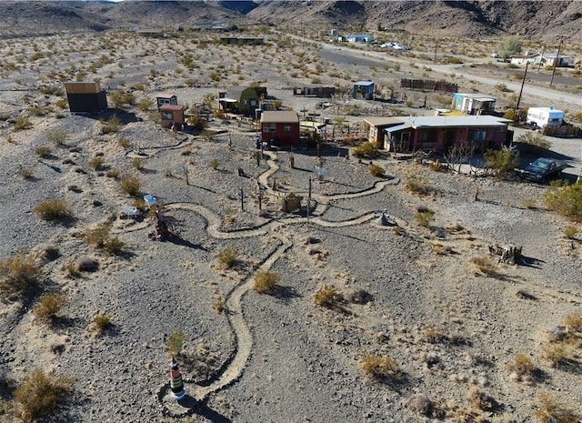 bird's eye view featuring a mountain view and view of desert