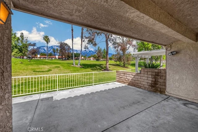 view of patio / terrace featuring a mountain view