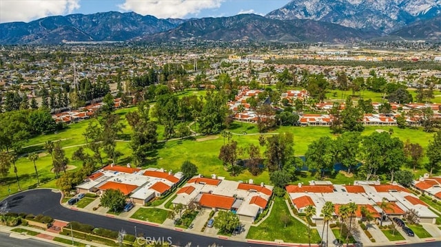 birds eye view of property featuring a mountain view and a residential view