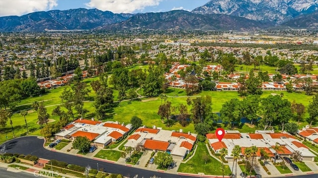 birds eye view of property with a residential view and a mountain view