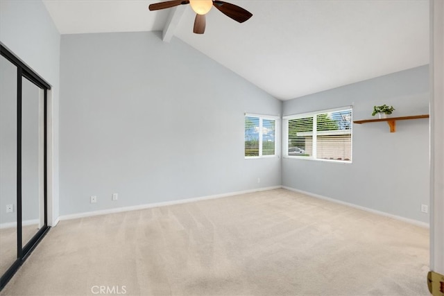 unfurnished bedroom featuring carpet floors, baseboards, and beamed ceiling