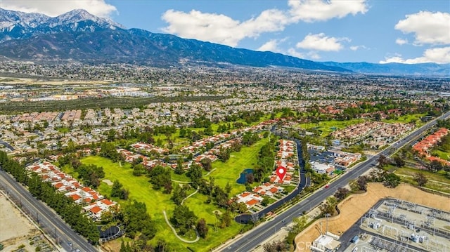 birds eye view of property with a mountain view