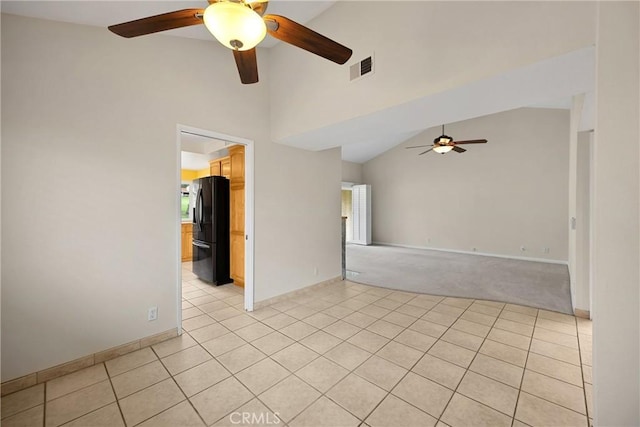 unfurnished room featuring visible vents, light tile patterned flooring, baseboards, high vaulted ceiling, and a ceiling fan