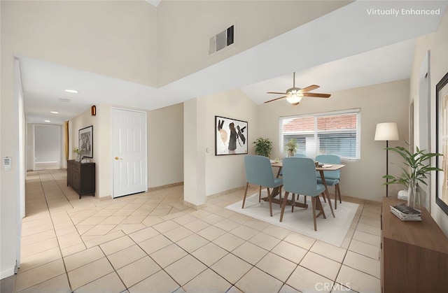 dining area featuring a ceiling fan, visible vents, and light tile patterned floors