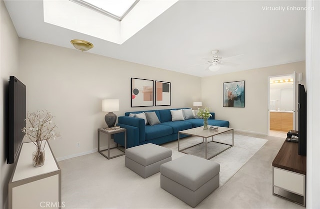 living area with baseboards, ceiling fan, light carpet, and a skylight