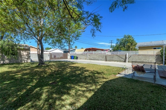 view of yard with a patio and a fenced backyard