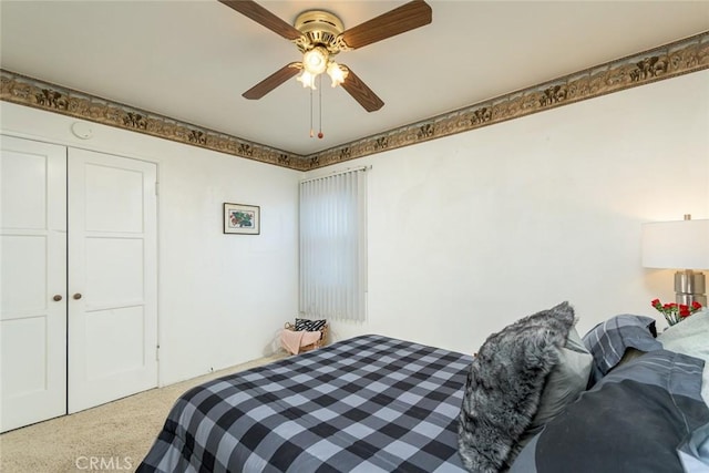 carpeted bedroom with a ceiling fan