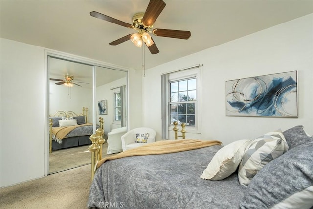 bedroom featuring carpet, a closet, and ceiling fan