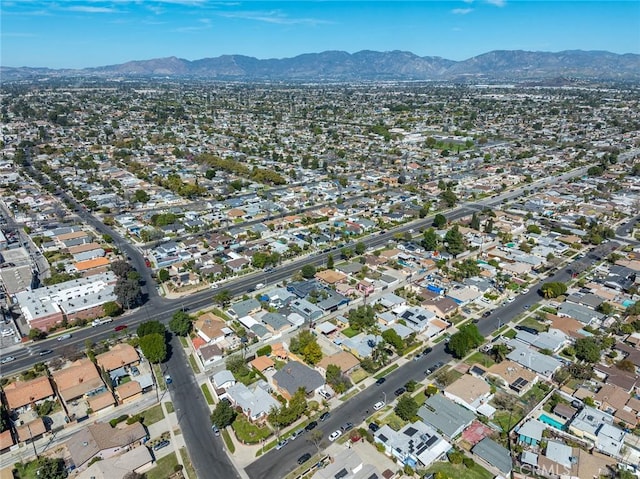 birds eye view of property with a mountain view and a residential view