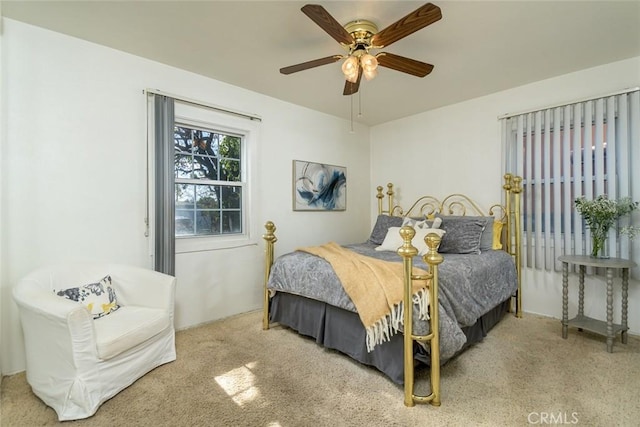 bedroom with ceiling fan and carpet