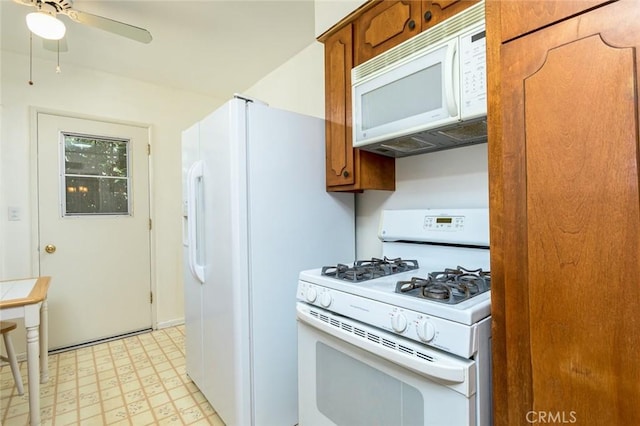 kitchen featuring a ceiling fan, white appliances, light floors, and brown cabinets