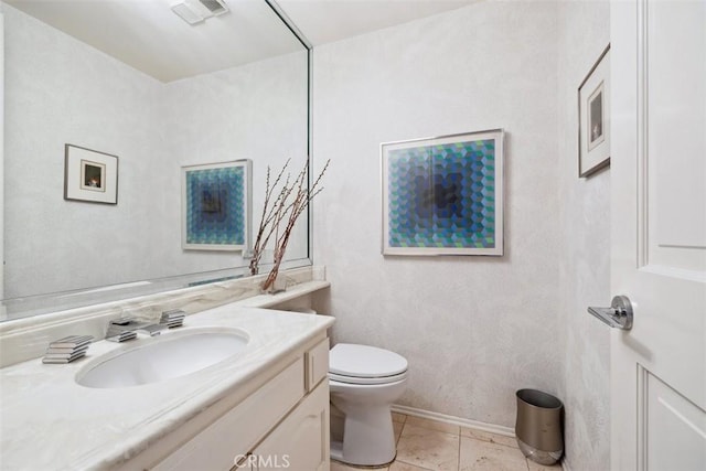 bathroom featuring vanity, tile patterned floors, toilet, and visible vents