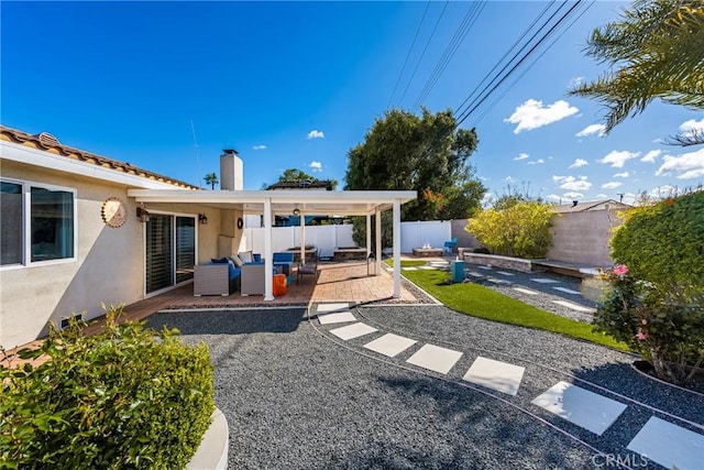 view of yard featuring outdoor lounge area, a patio, and a fenced backyard