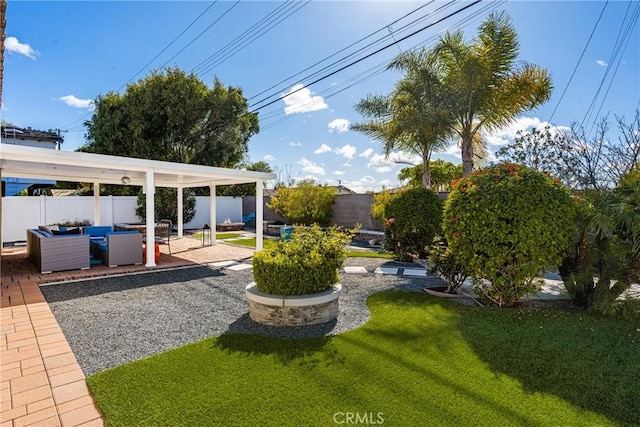 view of yard with a fenced backyard, outdoor lounge area, and a patio area