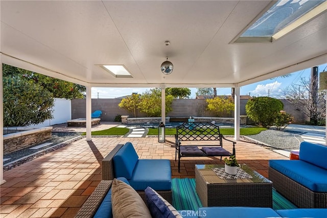 view of patio featuring an outdoor living space and a fenced backyard