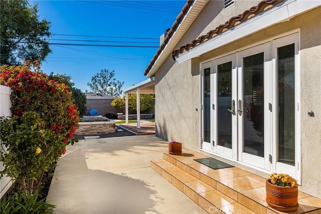 view of patio / terrace featuring french doors and a fenced backyard