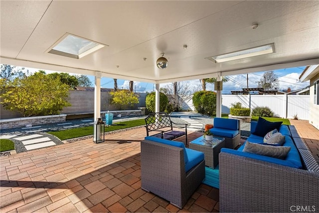 view of patio / terrace with an outdoor living space and a fenced backyard