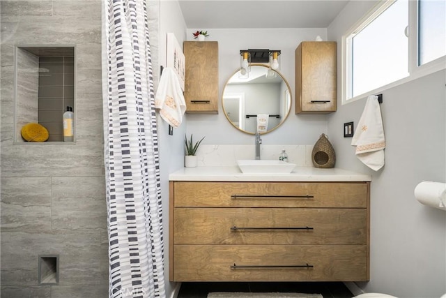 full bath with vanity and curtained shower