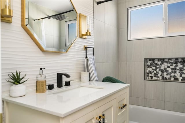 full bathroom featuring vanity, tile walls, shower / bath combo with shower curtain, and tasteful backsplash