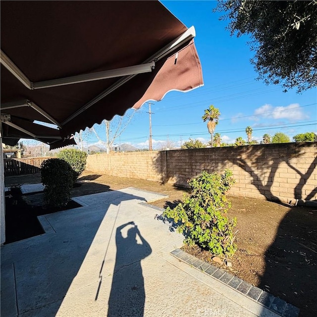 view of yard with a patio area and a fenced backyard