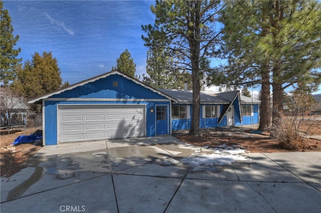 view of front of property with a garage and driveway