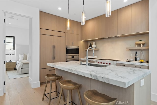 kitchen with open shelves, a sink, built in refrigerator, double oven, and modern cabinets