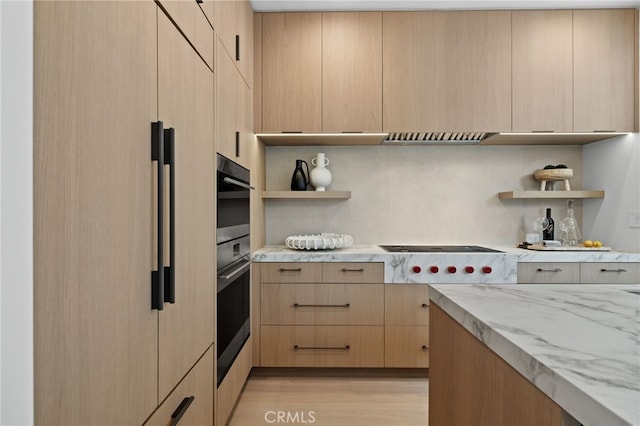 kitchen featuring open shelves, oven, and light brown cabinetry