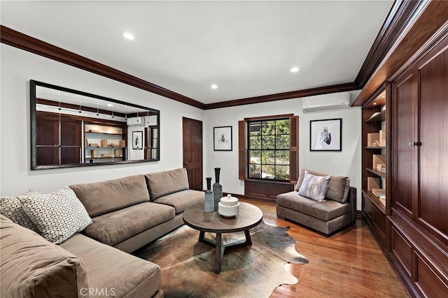 living area featuring recessed lighting, ornamental molding, a wall mounted air conditioner, and wood finished floors