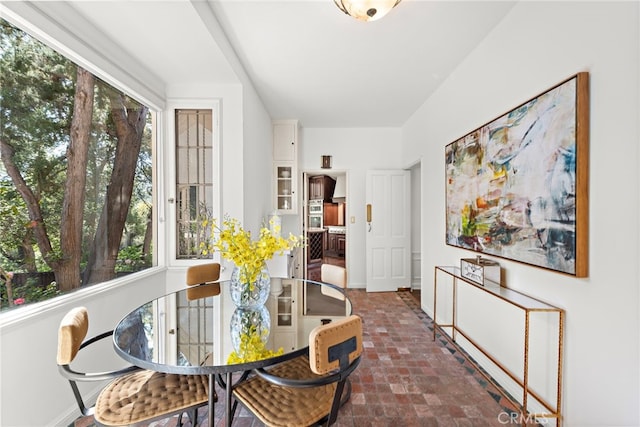 dining room with a healthy amount of sunlight and baseboards