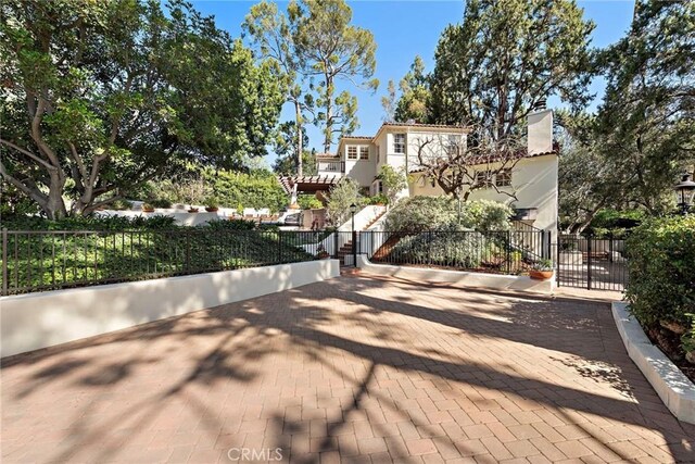 exterior space with a gated entry and a gate