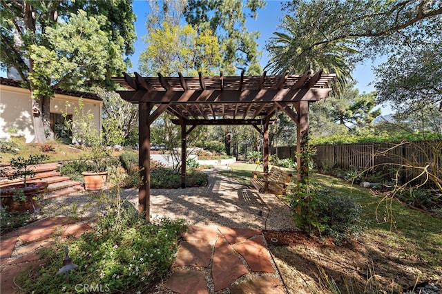 view of patio / terrace featuring a pergola and fence