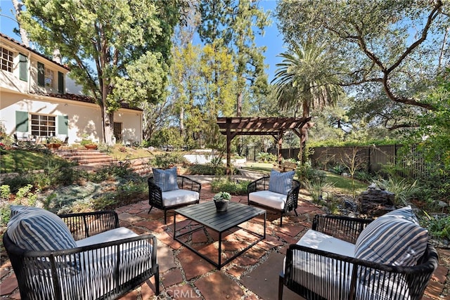 view of patio / terrace featuring an outdoor living space, a pergola, and fence