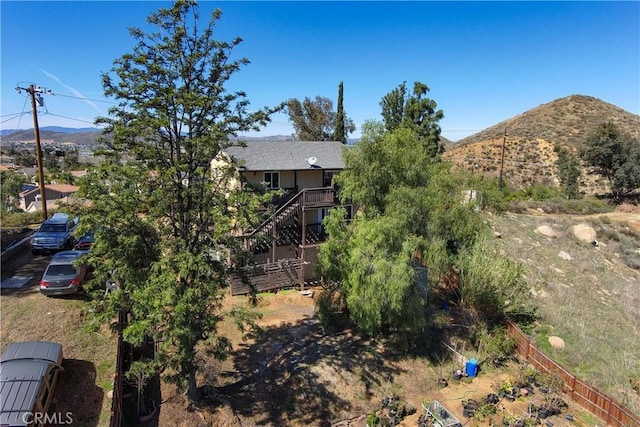 exterior space with a mountain view and stairs