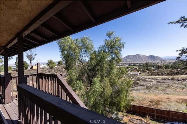 balcony featuring a deck with mountain view