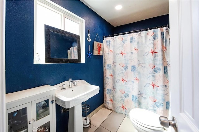 full bathroom with tile patterned floors, a shower with curtain, and toilet