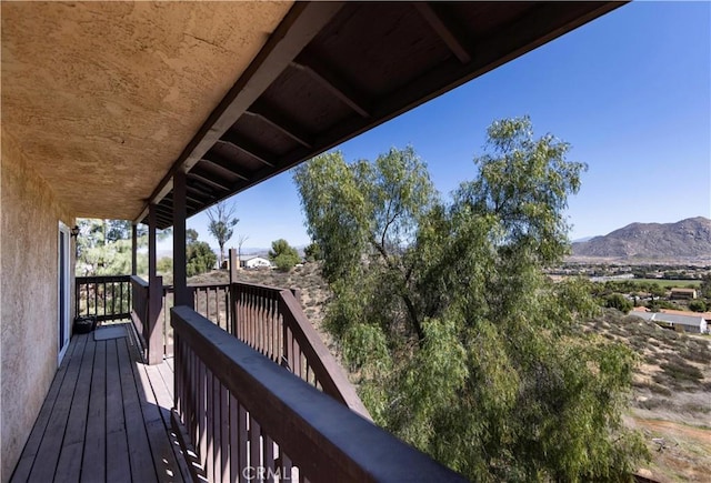 wooden terrace featuring a mountain view