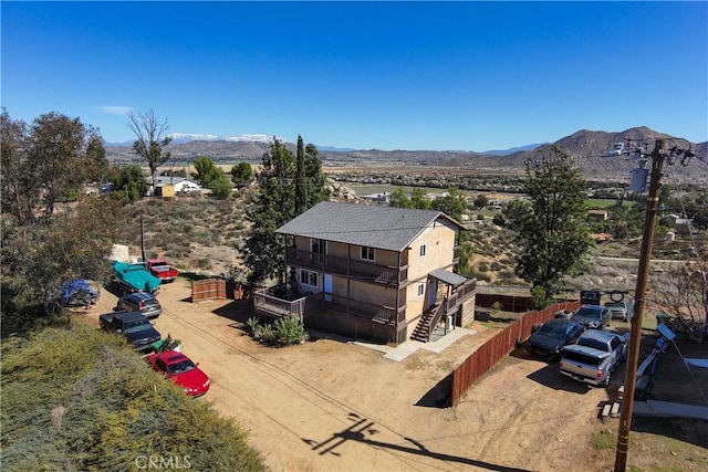 birds eye view of property with a mountain view