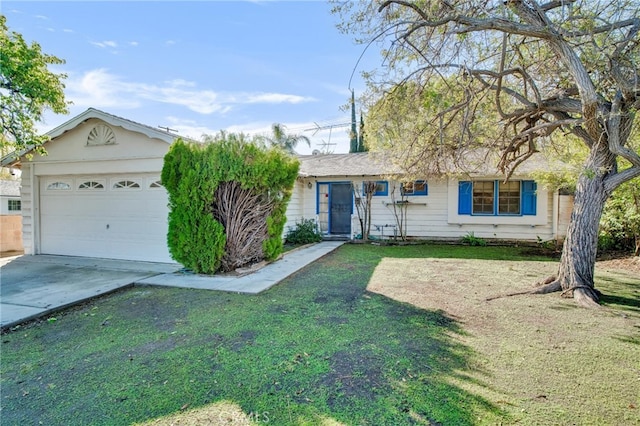 single story home with a front lawn, concrete driveway, and an attached garage