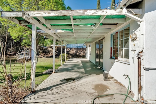 view of patio / terrace featuring fence