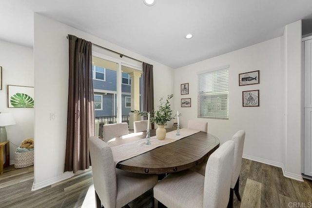 dining area with dark wood finished floors, recessed lighting, and baseboards