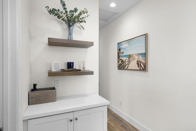 interior space with recessed lighting, baseboards, and wood finished floors