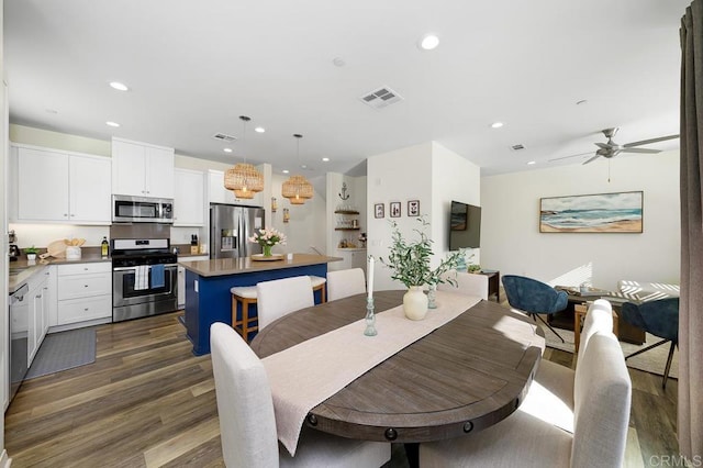 dining area with dark wood finished floors, visible vents, recessed lighting, and ceiling fan