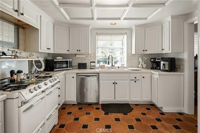 kitchen featuring a sink, light countertops, white cabinets, and stainless steel appliances